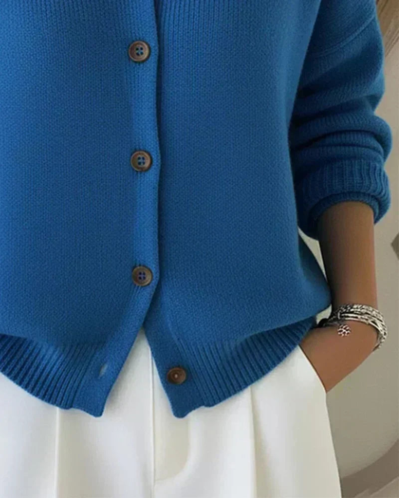 Women’s blue button-collar cardigan detail view with button placket and ribbed hem