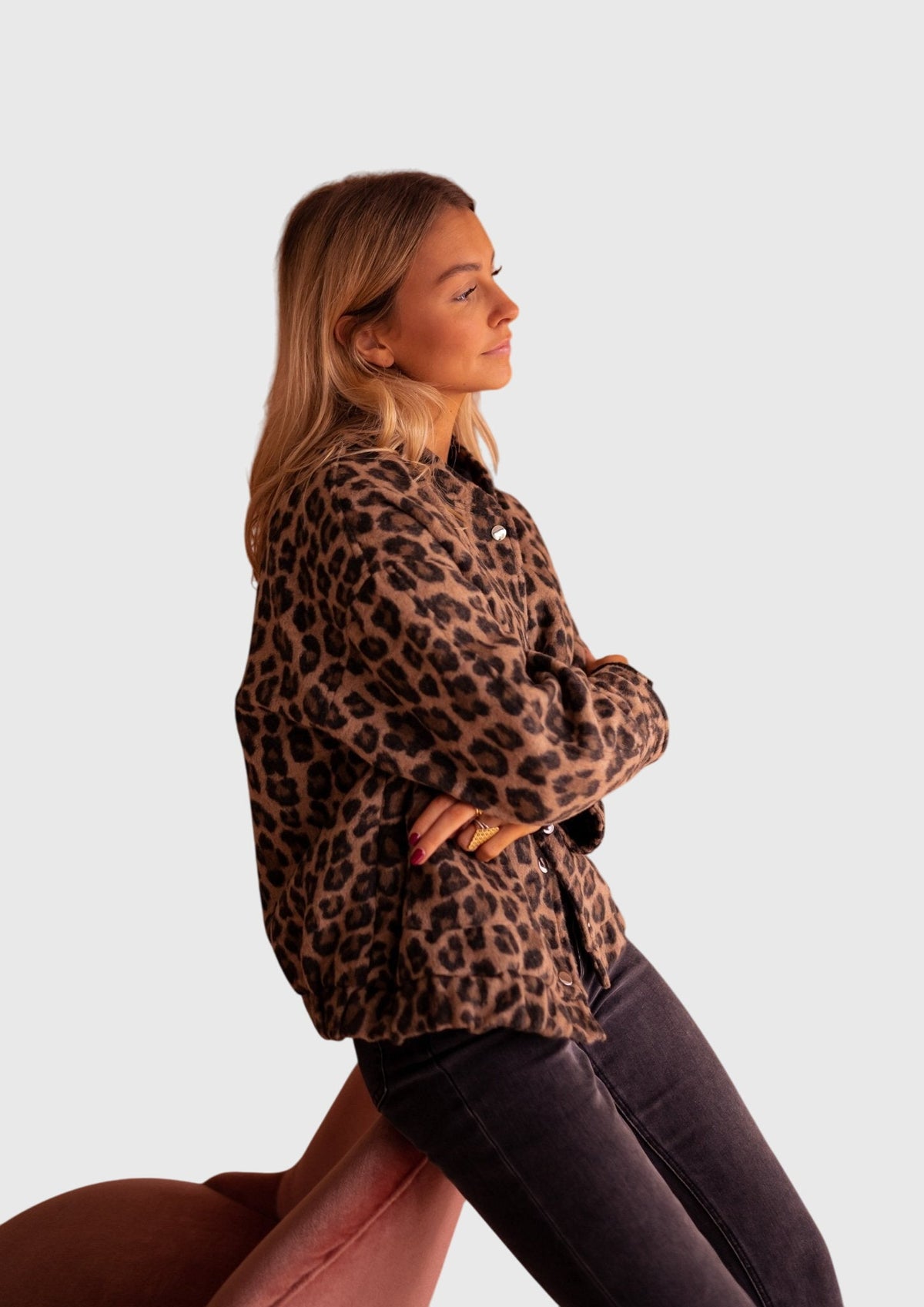 Leopard print jacket with button front, long sleeves, and side pockets