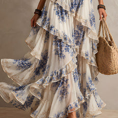 Blue and white floral ruffle maxi dress with tiered skirt detail and halter neckline