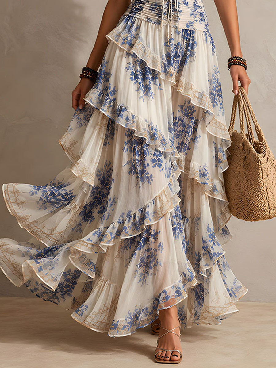 Blue and white floral ruffle maxi dress with tiered skirt detail and halter neckline