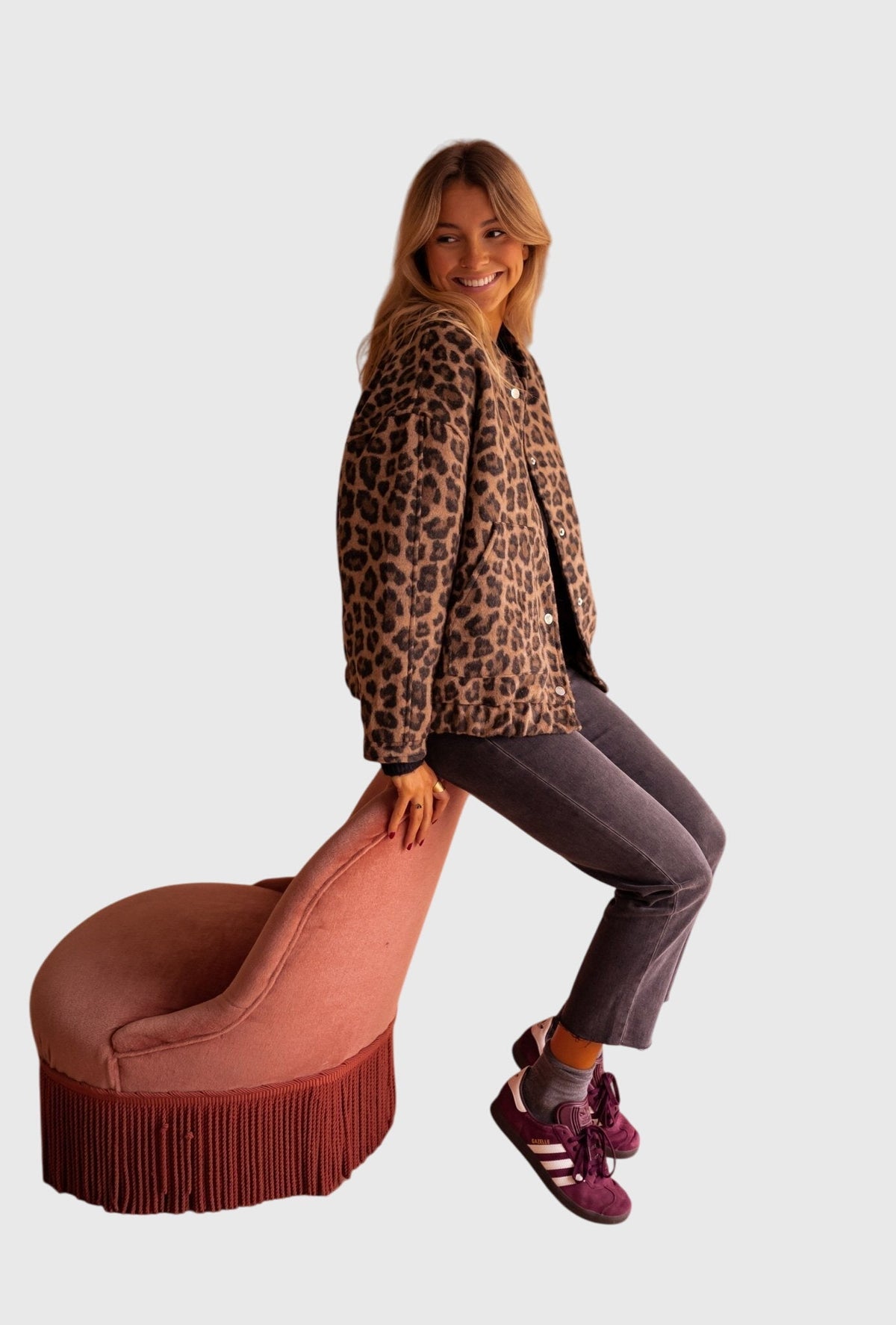 Leopard print jacket with button front, long sleeves, and front pockets