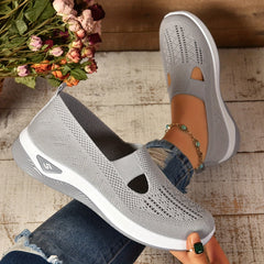 Light gray knit slip-on shoes with side cutouts and white sole