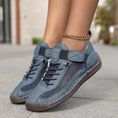 Scarpe ortopediche traspiranti blu con lacci e cinturino, suola ammortizzata.