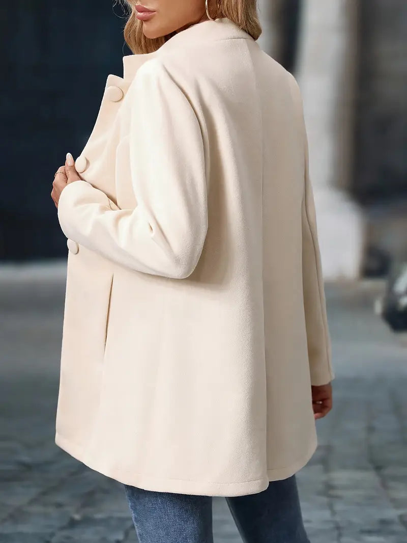 Cream classic elegant jacket shown from the back with button details