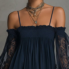 Navy off-shoulder smocked mini dress with lace-trim sheer sleeves and delicate neckline.