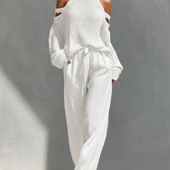 Camilla fashionable set: white sleeveless turtleneck knit with cold-shoulder and wide-leg pants