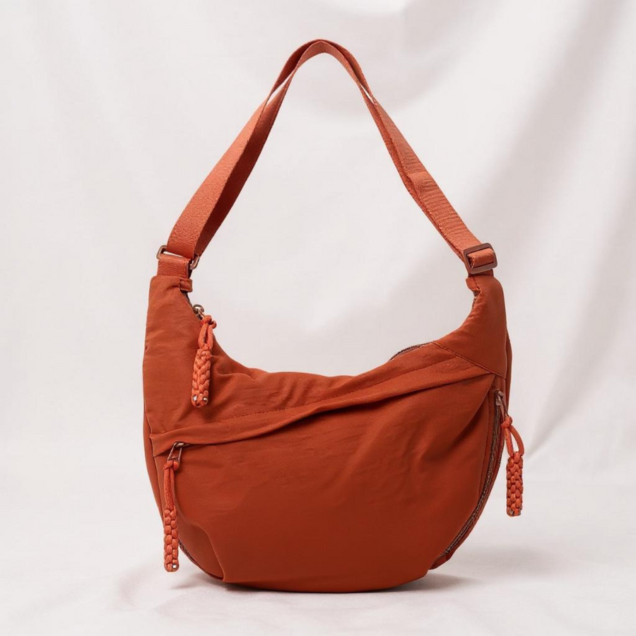 Borsa a tracolla in tessuto arancione con zip laterale e tracolla regolabile