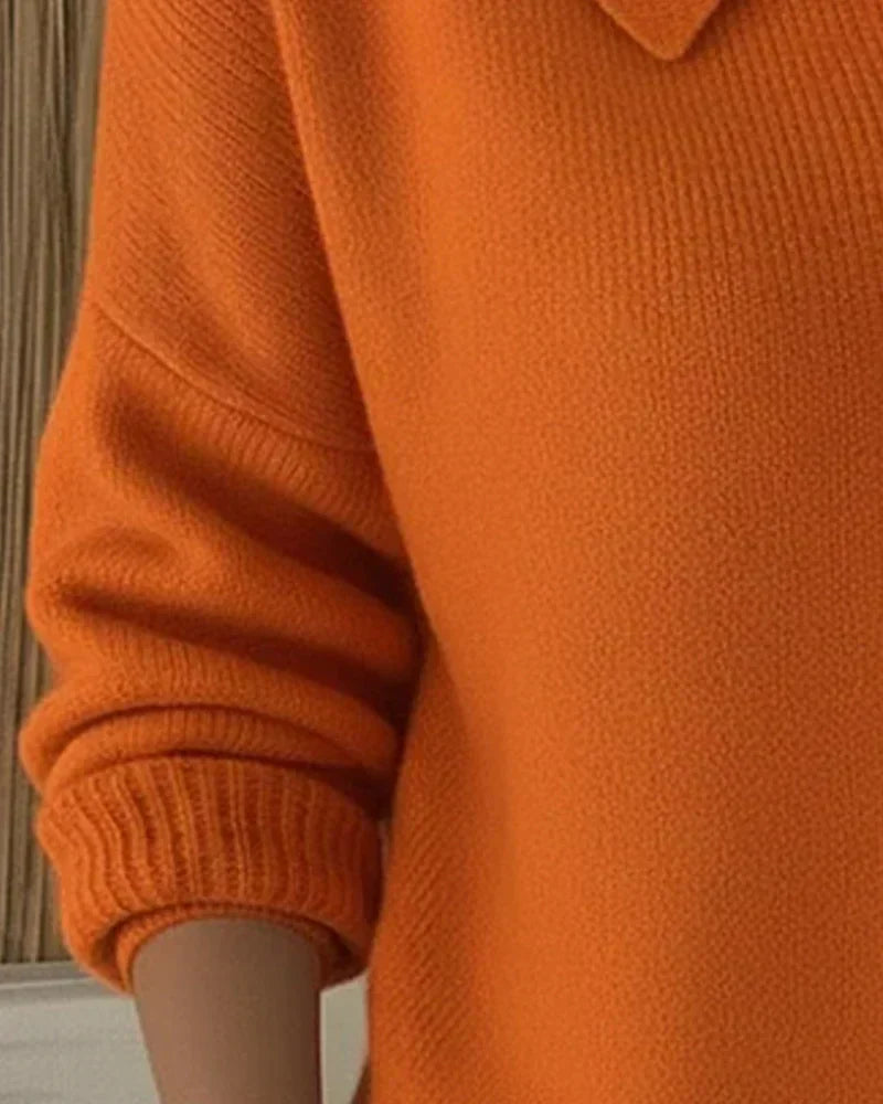 Women’s orange button-collar cardigan sleeve detail with ribbed cuff and knit texture