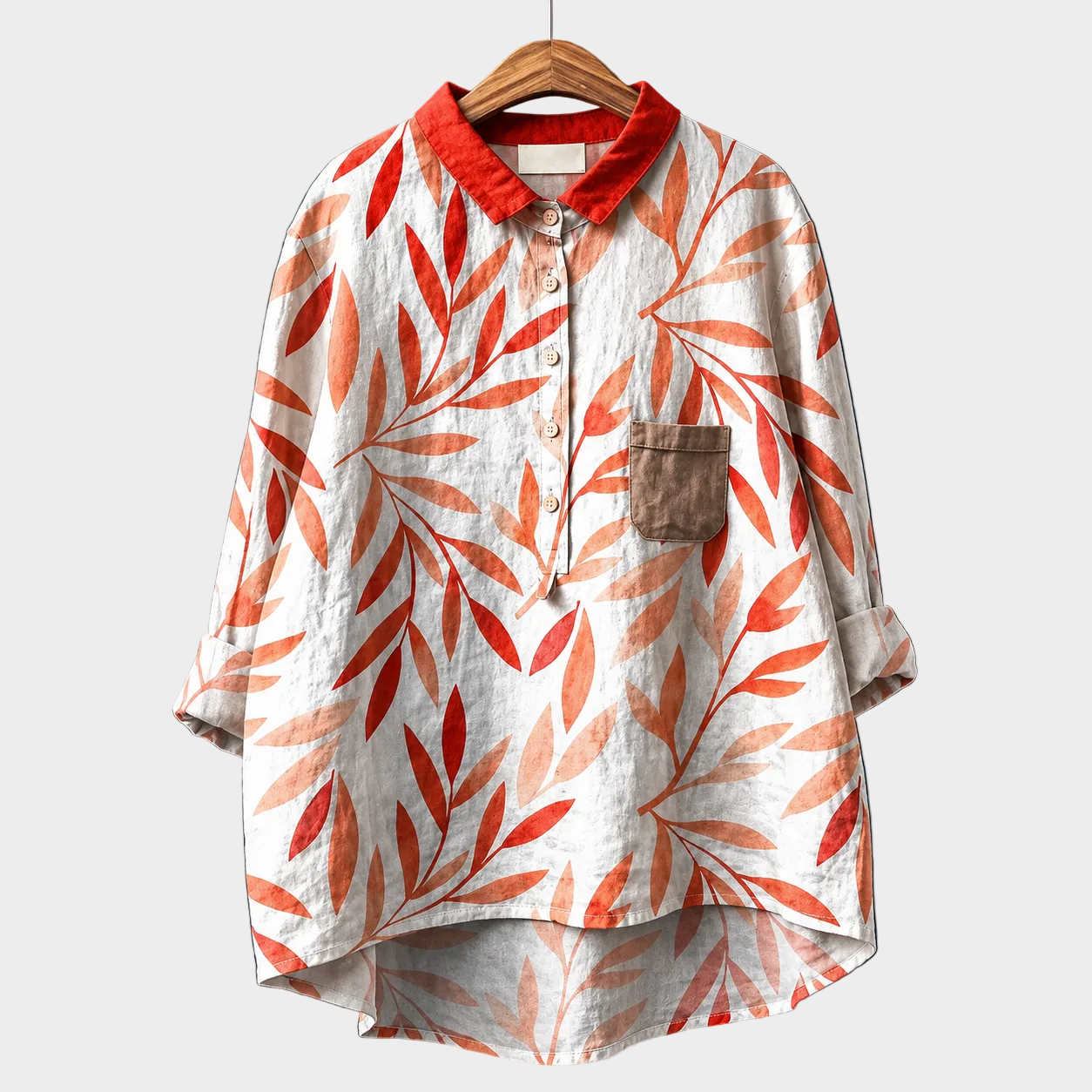 Blusa estiva leggera con colletto e bottoni, maniche lunghe, fantasia foglie arancio su bianco