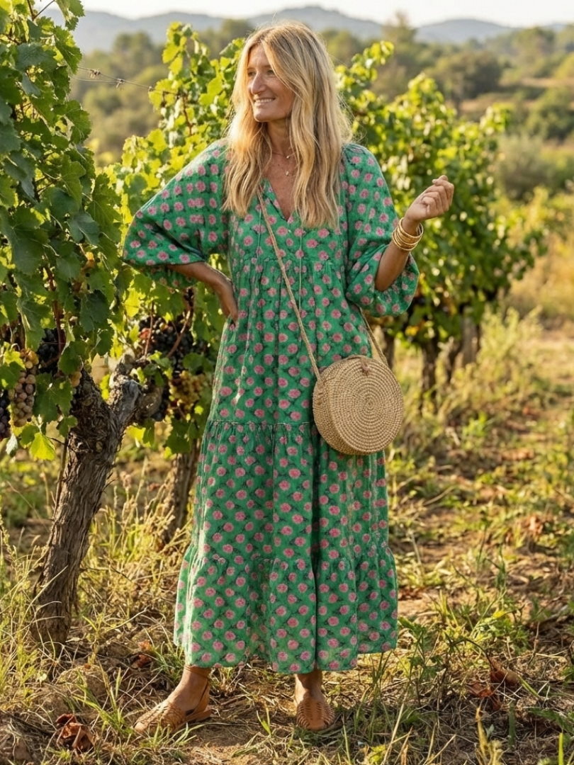 Dark green floral print V-neck tiered midi dress with full, tiered skirt and 3/4 sleeves