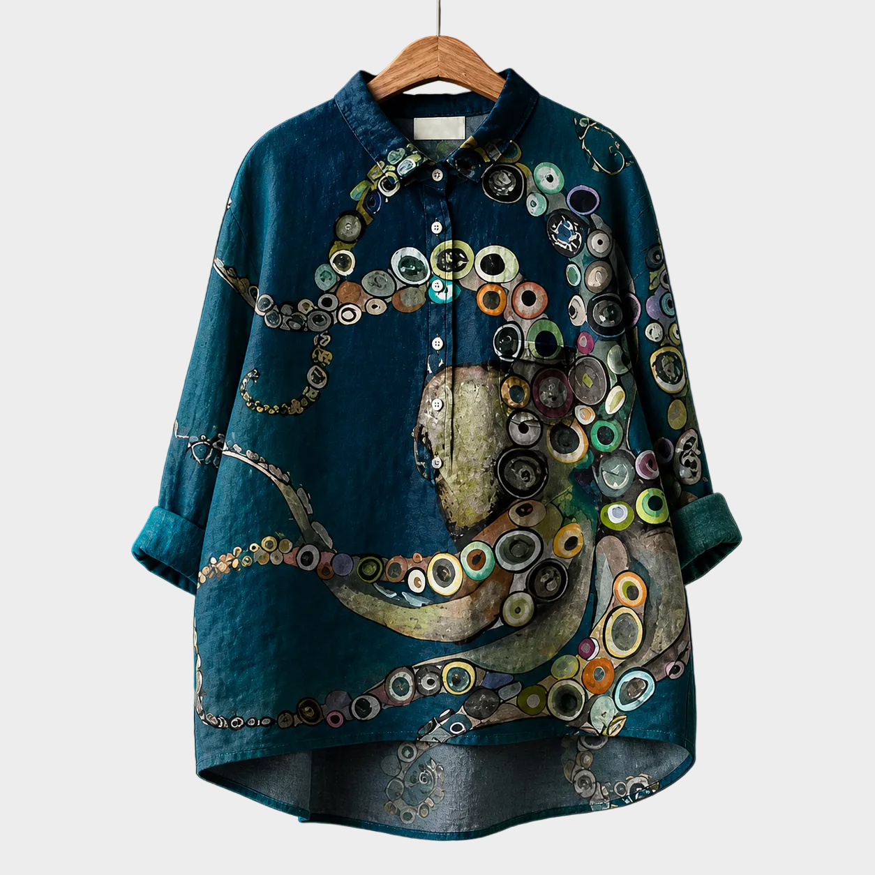 Blusa estiva elegante blu petrolio, maniche corte, colletto e bottoni, fantasia astratta