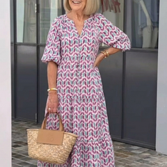 Geometric print tiered midi dress with V-neck and 3/4 puff sleeves, lilac-teal pattern