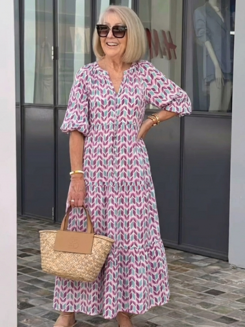 Geometric print tiered midi dress with V-neck and 3/4 puff sleeves, lilac-teal pattern