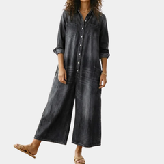 Washed black denim button-through dress with collar, long sleeves, and front patch pockets
