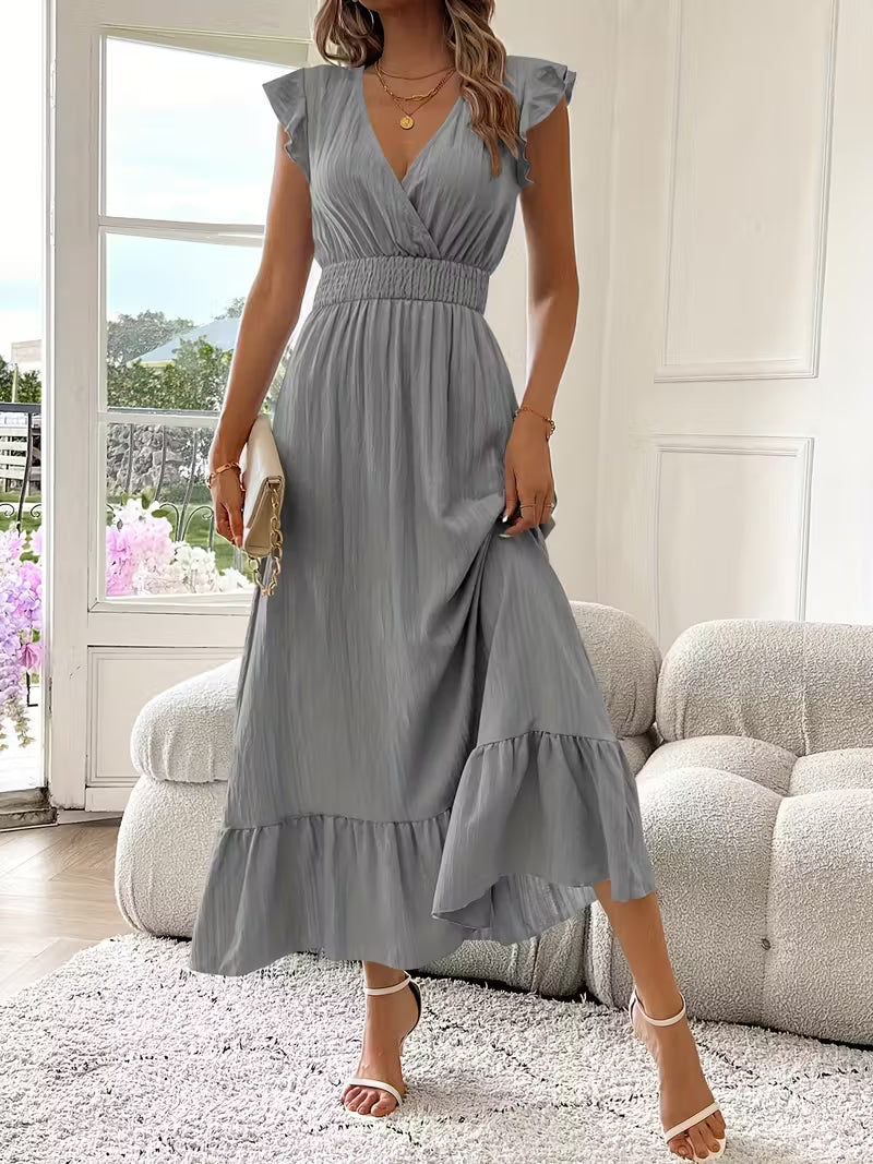 Abito midi grigio perla con scollo a V, cintura arricciata e gonna a balze