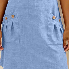 Abito in cotone azzurro: tasche laterali con bottoni e piega decorativa