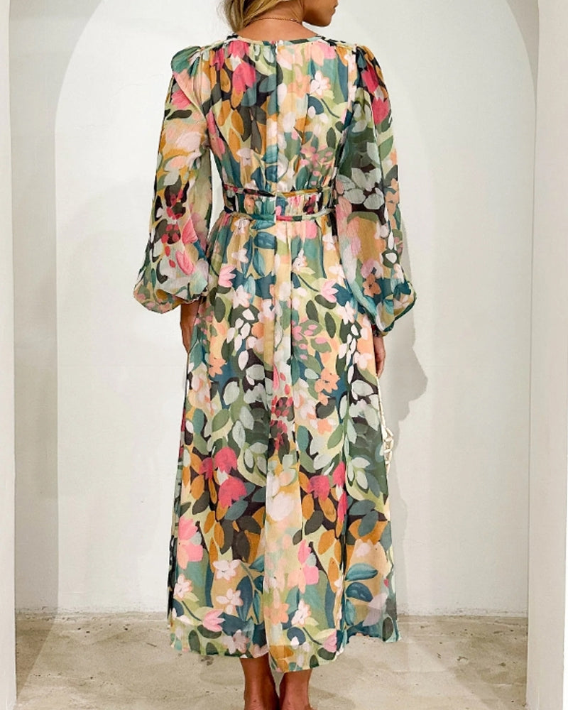Abito femminile floreale multicolore con vista posteriore: cintura in vita e maniche a palloncino