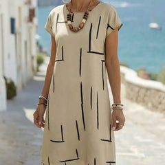 Abito fluttuante beige con stampa a linee nere, maniche corte e scollo rotondo