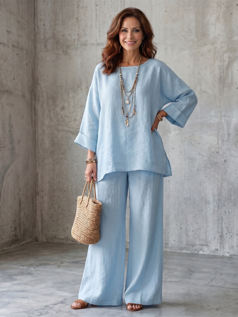 Light blue oversized tunic and wide-leg pants set with round neckline and bracelet cuffs