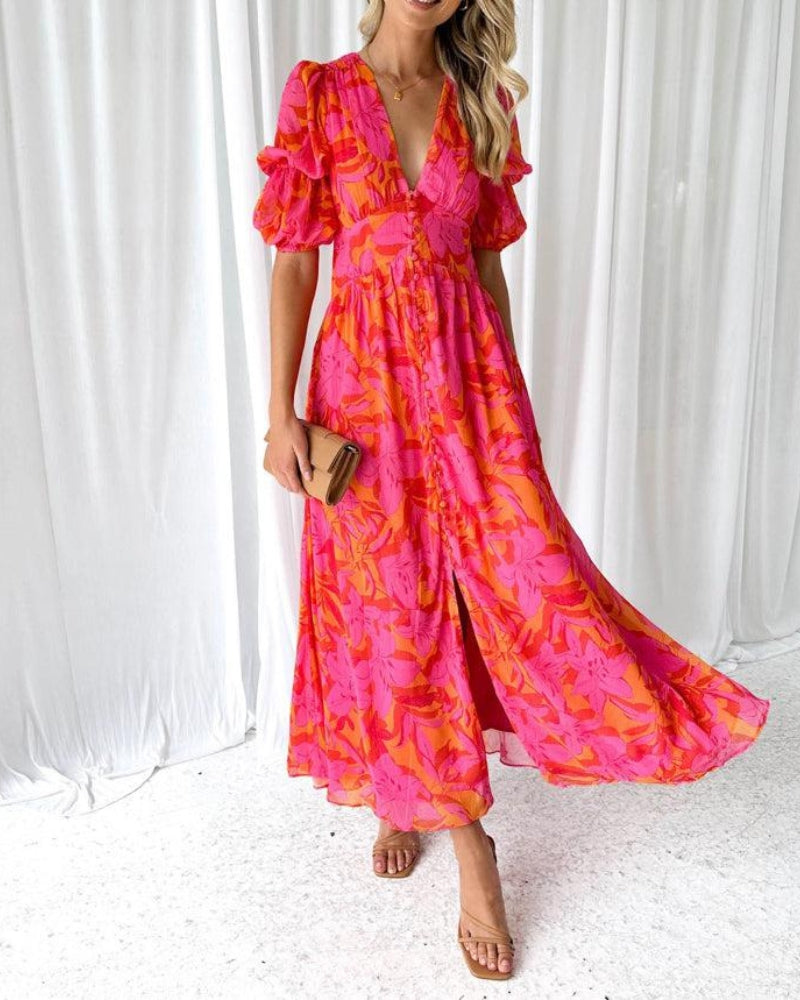 Abito maxi con scollo a V e maniche a balze; gonna svolazzante a fantasia rosa-arancio