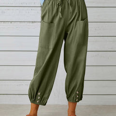 Army green high-waist drawstring jogger trousers with side pockets and snap cuffs.