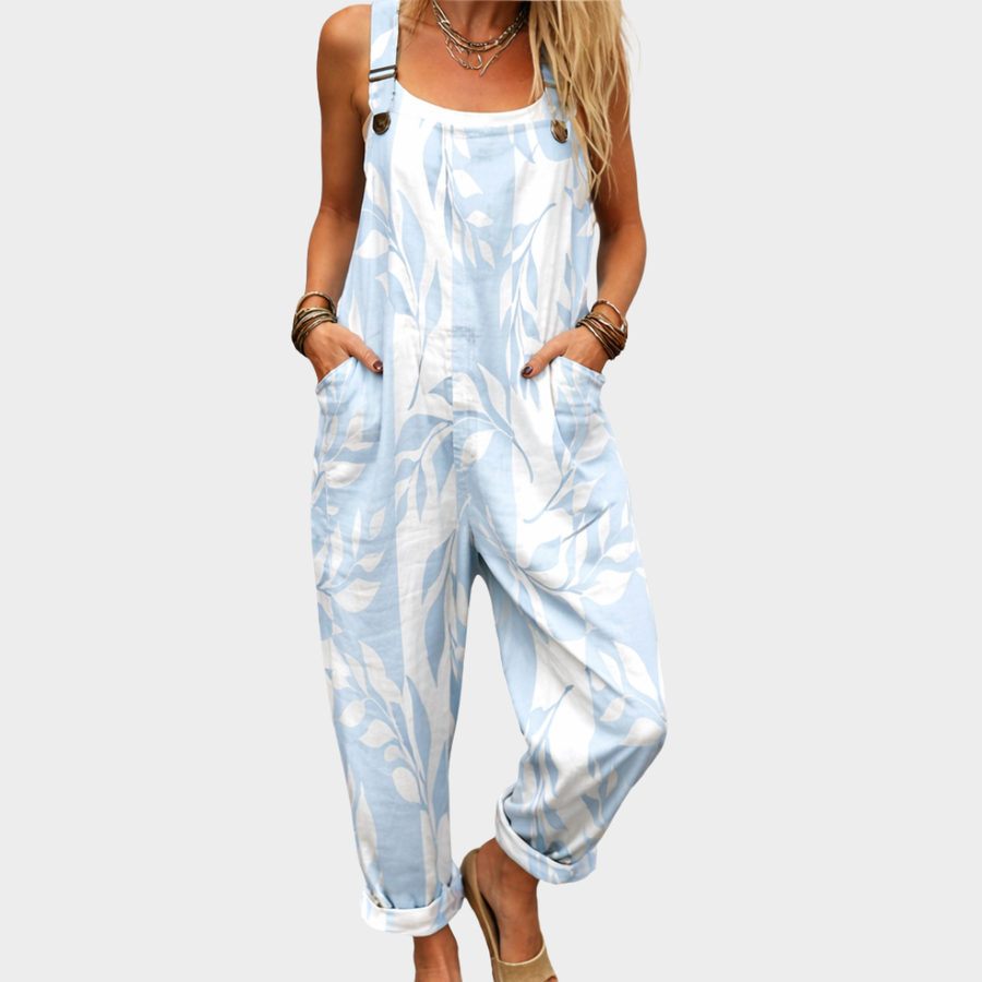 Light blue and white printed overalls with front bib, adjustable straps, and pockets