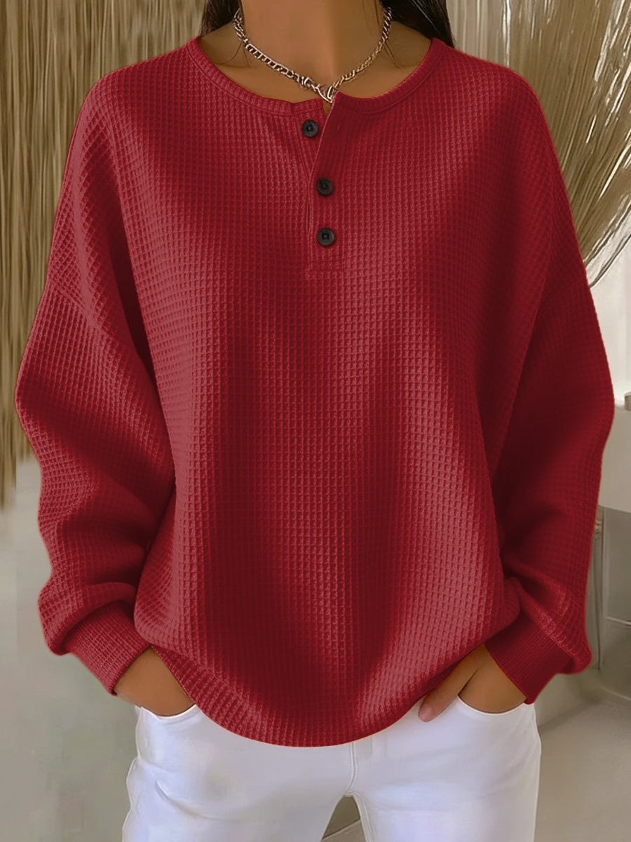 Red waffle henley sweatshirt with dark buttons and long sleeves