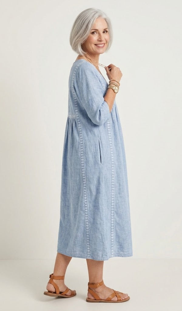 Light blue A-line maxi dress with V-neckline and elbow-length sleeves, side view