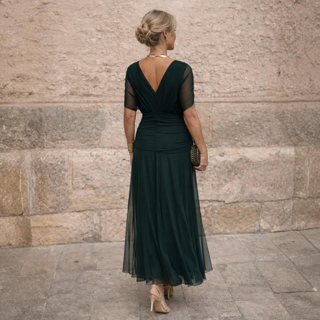 Abito lungo verde scuro con scollo dietro a V e gonna tulle a pieghe