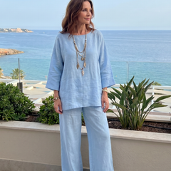 Light blue oversized tunic and wide-leg pants set with round neckline and cuffed sleeves
