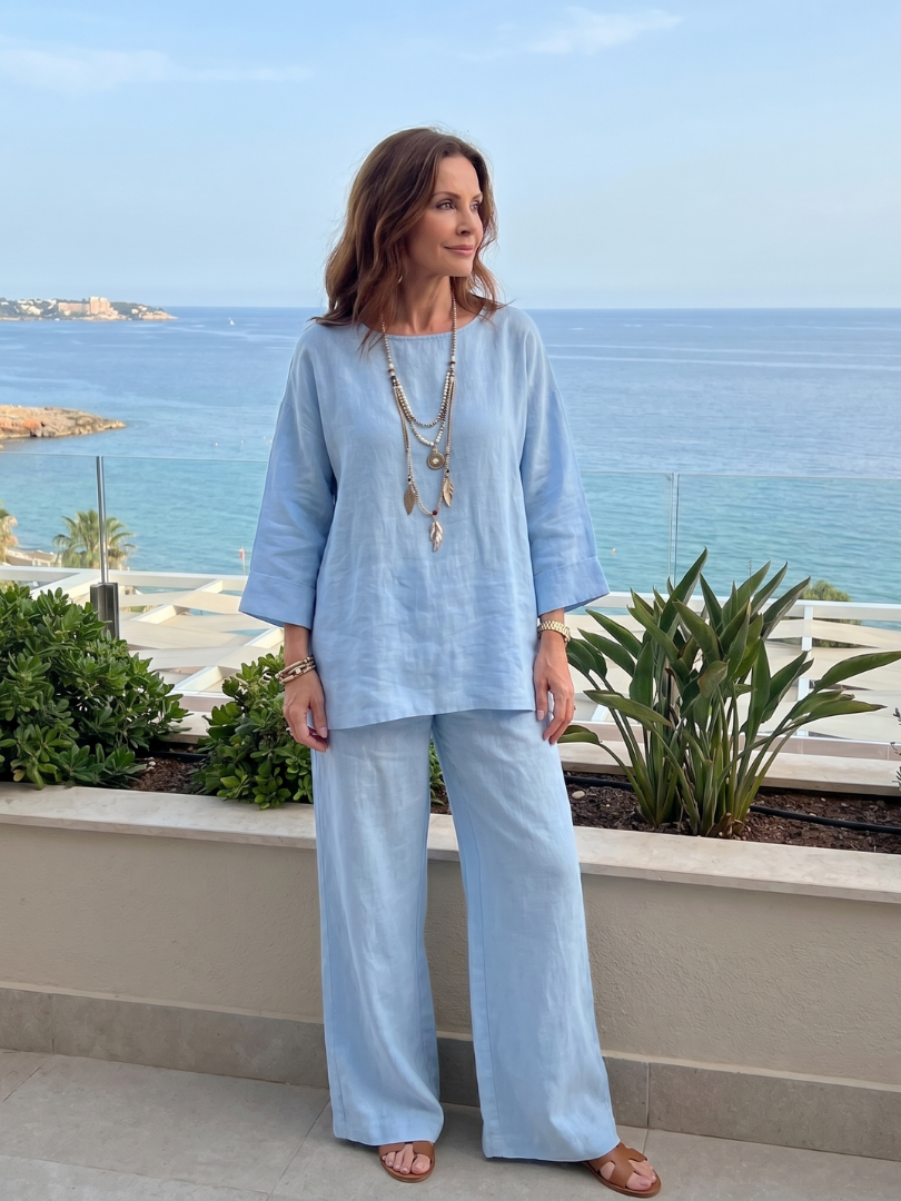 Light blue oversized tunic and wide-leg pants set with round neckline and cuffed sleeves