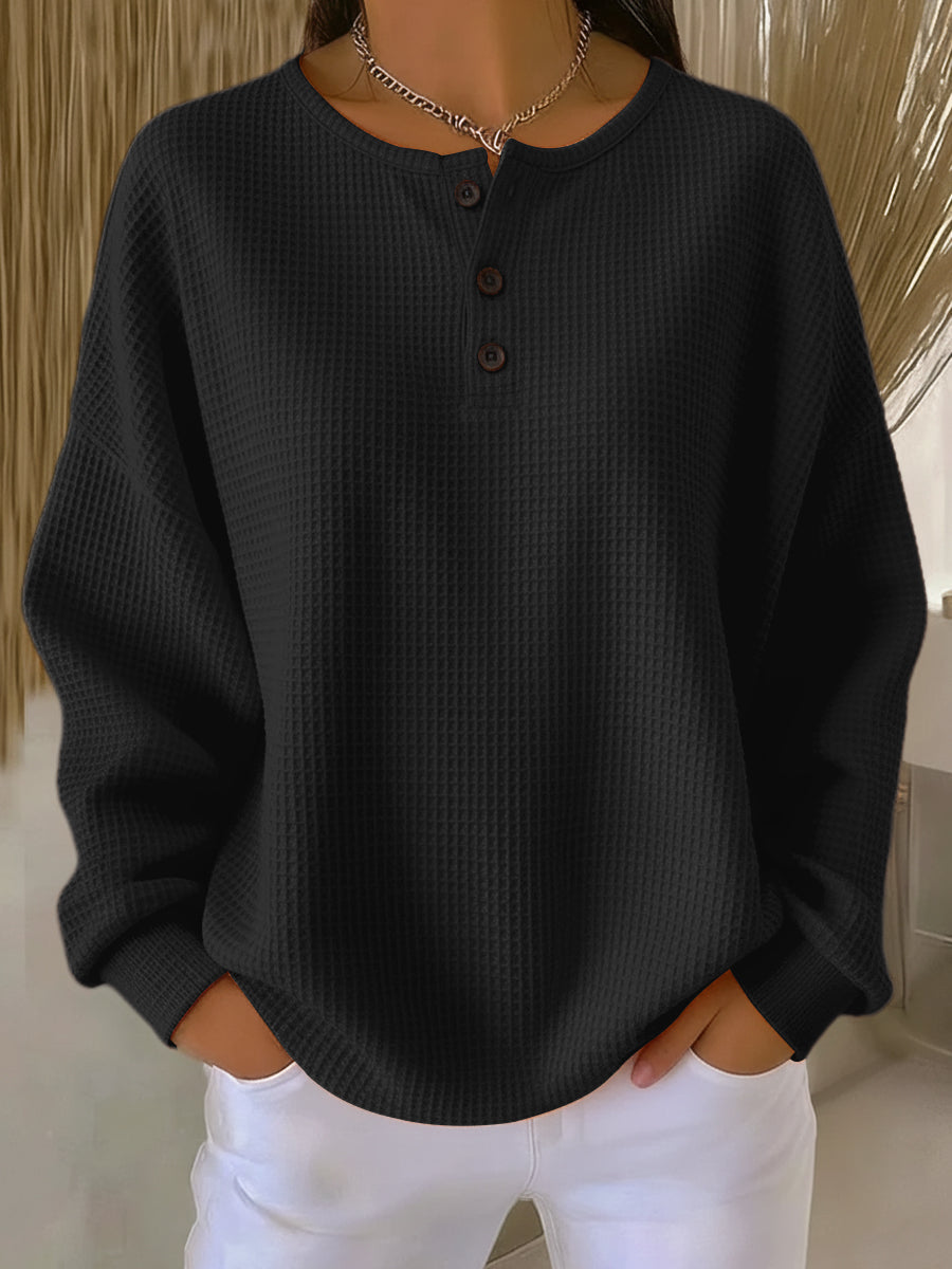 Black waffle henley sweatshirt with buttoned placket and long sleeves