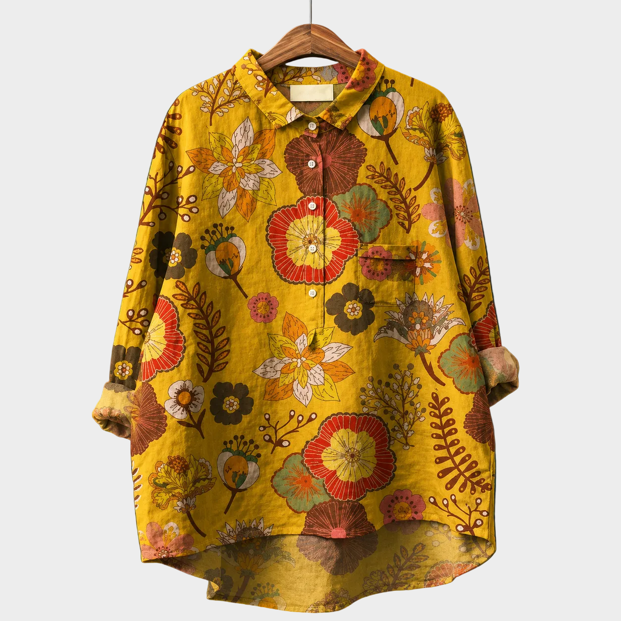 Blusa estiva gialla con stampa floreale multicolore, bottoni e colletto