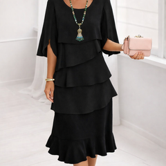 Black ruffle tier midi dress with layered ruffle bodice and tiered hem