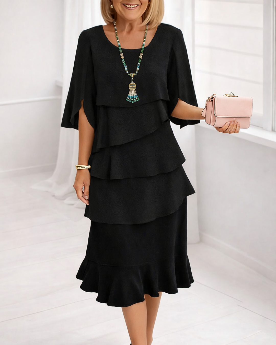 Black ruffle tier midi dress with layered ruffle bodice and tiered hem