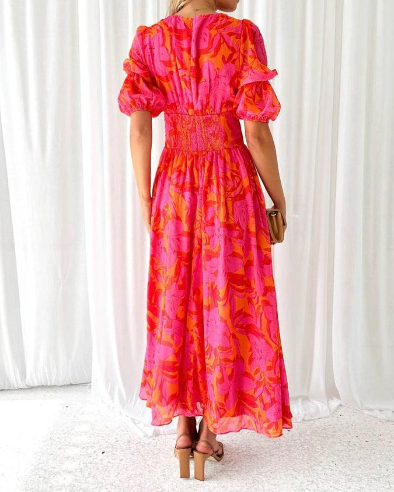Abito maxi sul retro con gonna lunga a fantasia rosa-arancio e maniche a sbuffo