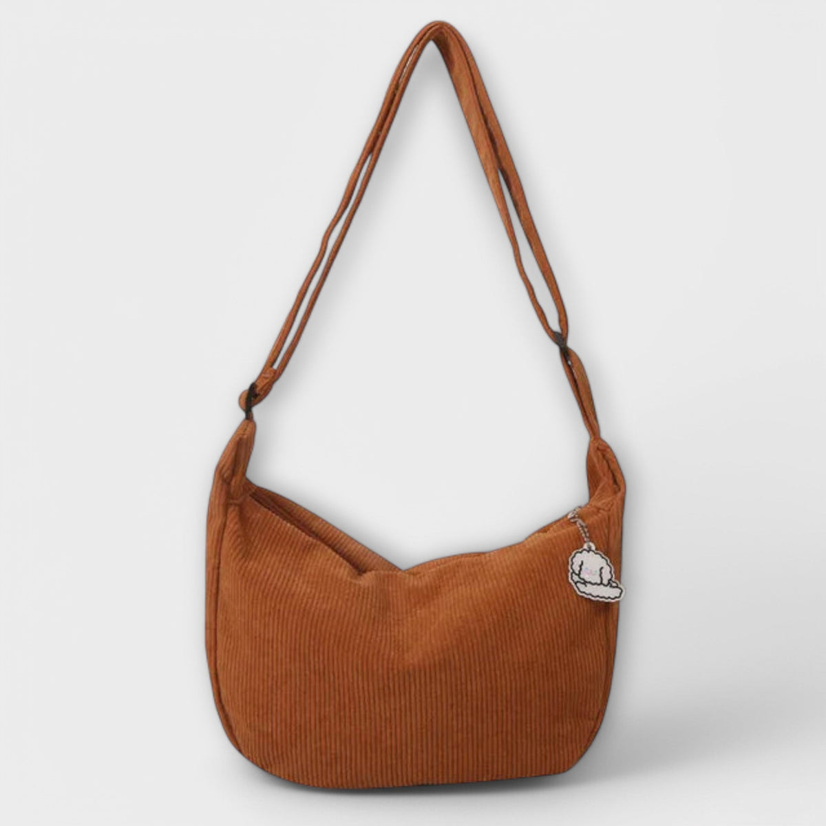Alexa women’s shoulder bag, orange-brown corduroy hobo shape with cloud charm patch