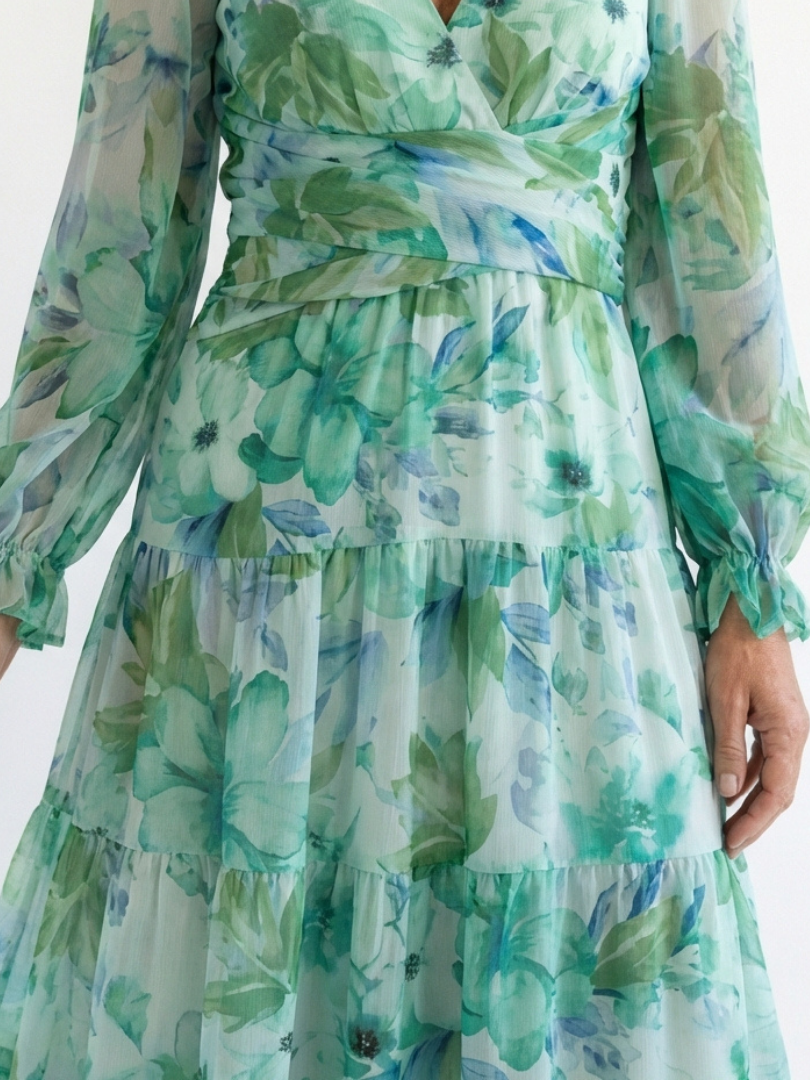 Althea long sleeve floral maxi dress close-up, teal-green tiered fabric and waist tie