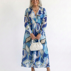 Long-sleeve blue abstract maxi dress with smocked waist and V-neckline
