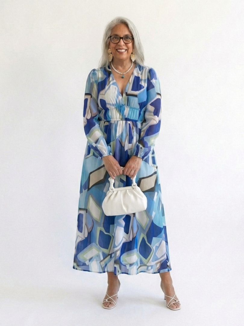 Long-sleeve blue abstract maxi dress with smocked waist and V-neckline