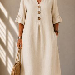 Light beige button-front midi dress with V-neck and three-quarter ruffle sleeves
