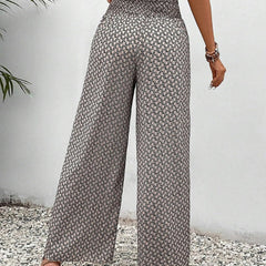 Grey wide-leg trousers with shirred waist, straight wide leg, micro pattern repeat.