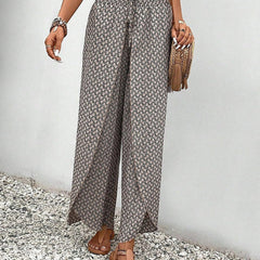 Grey wide-leg trousers with shirred waist and allover micro pattern, ankle length.