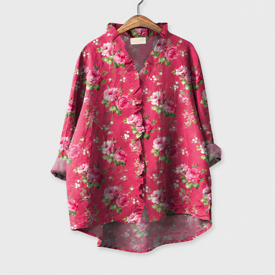 Blusa estiva rosa con scollo a V e maniche a tre quarti, motivo floreale