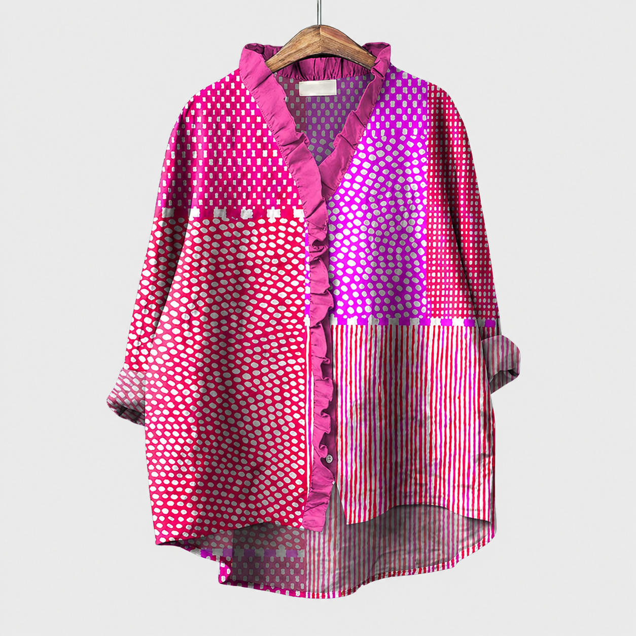 Blusa estiva elegante viola e fucsia, fantasia geometrica, maniche lunghe e balze sul davanti