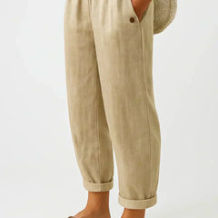 Beige linen-look cropped trousers with elastic waistband and button cuff hems