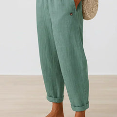 Turquoise linen-look cropped trousers with elastic waistband and button cuff hems