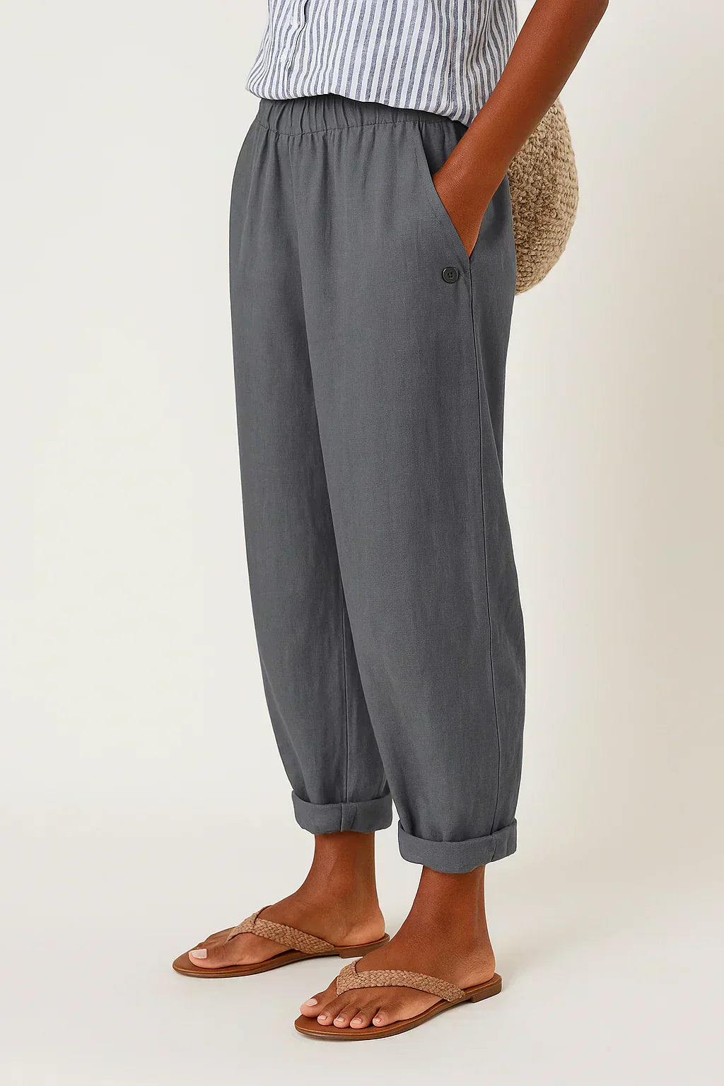 Dark gray linen-look cropped trousers with elastic waistband and button cuff hems