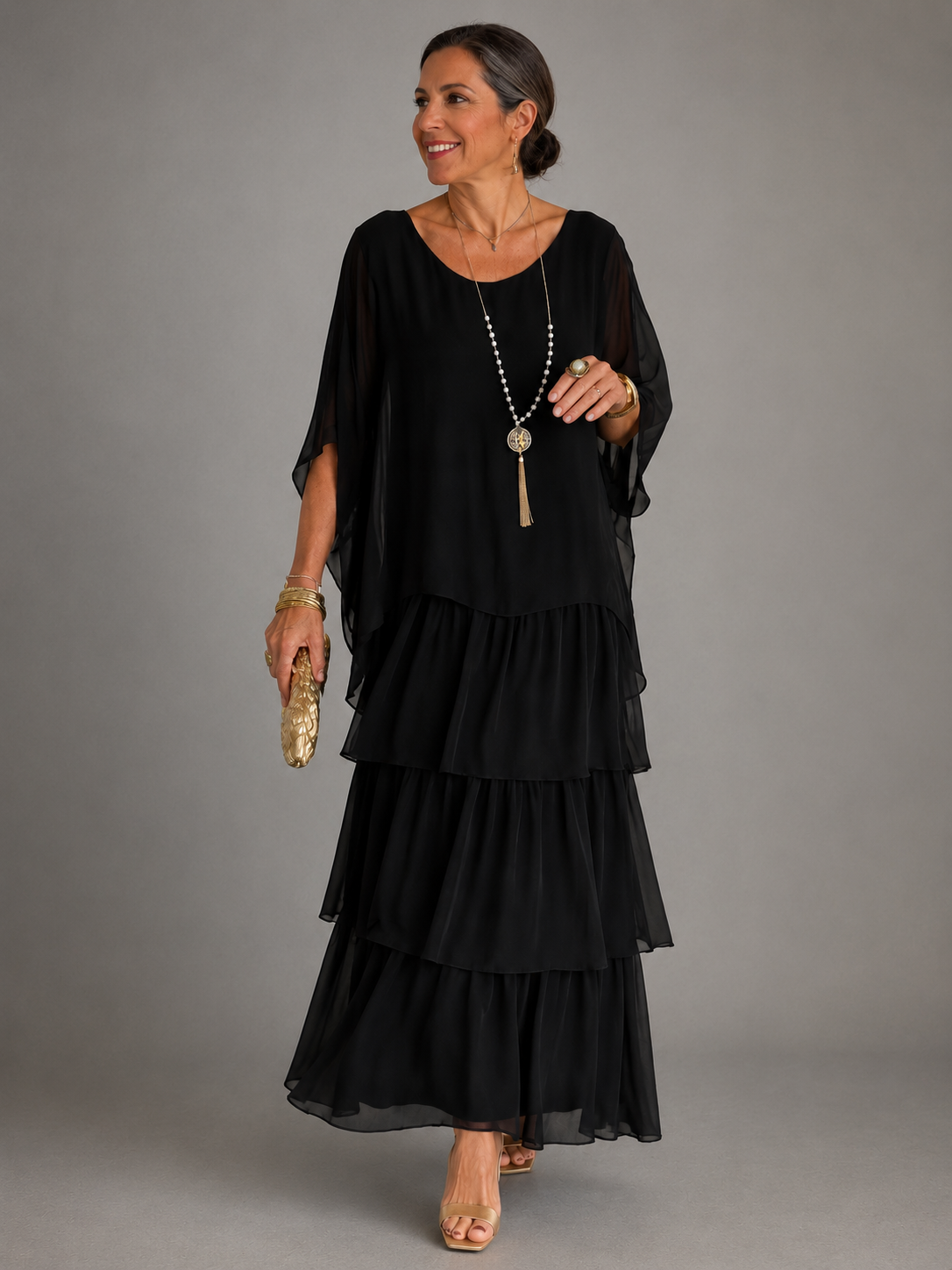 Black tiered maxi dress with loose dolman sleeves and scoop neckline, layered ruffle tiers
