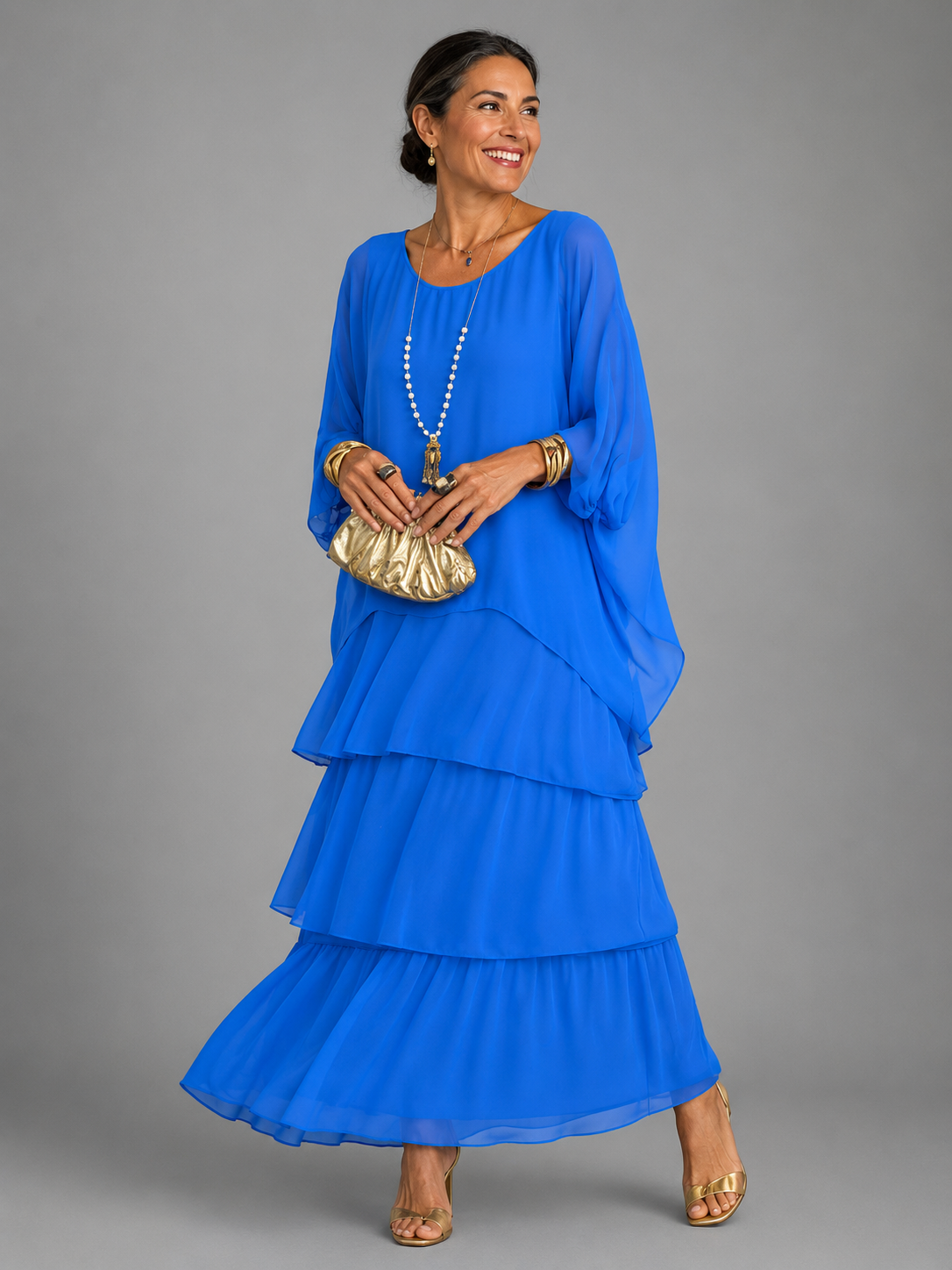 Bright blue tiered maxi dress with dolman sleeves and scoop neckline, airy layered ruffle tiers